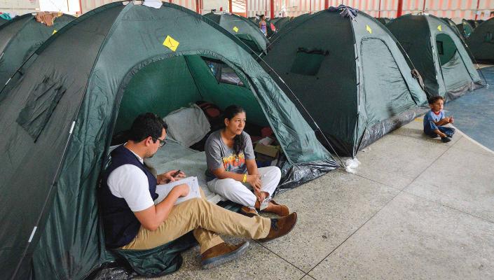 reporter interviewing migrant