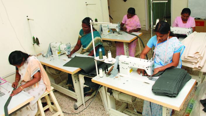 3 Indian women working at sewing machines