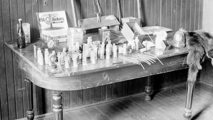  Image of a table containing cocaine, opium, and morphine taken from “dope fiends” in Chicago, Illinois, 1908. Photo by Chicago Sun-Times/Chicago Daily News collection/Chicago History Museum/Getty