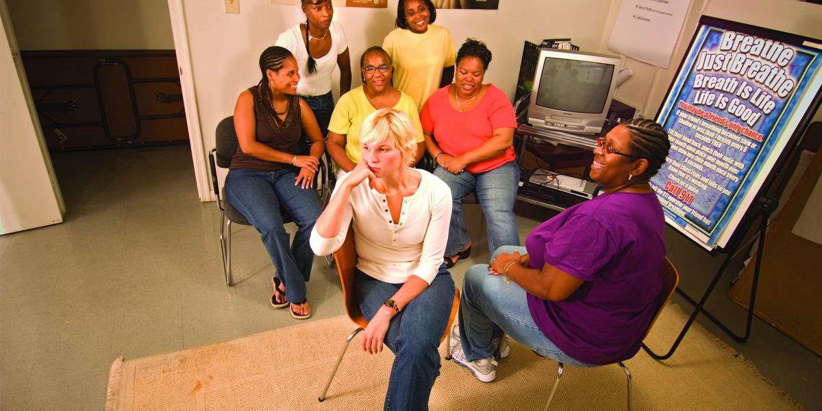 Kathy Dolan and Tiffany Walker-Hill lead discussions with five women