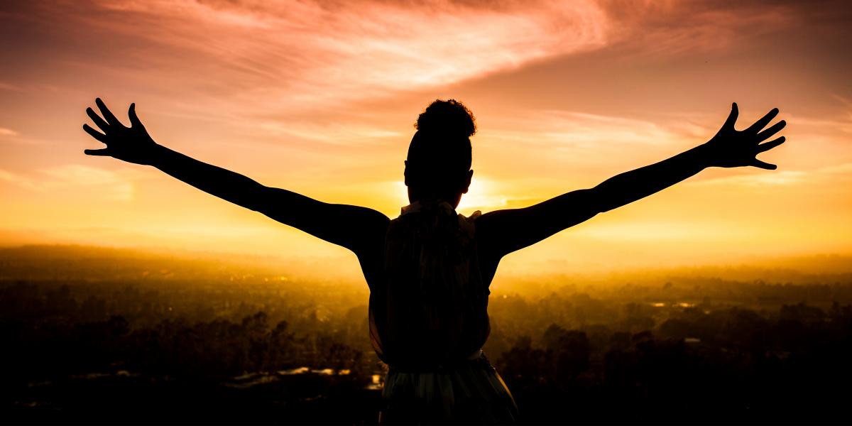 picture of woman with arms outstretched