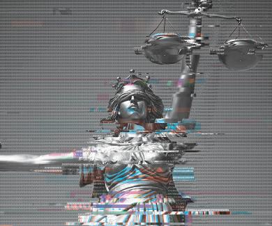 An image of a statue of holding a set of scales in one hand and a sword in the other, overlaid with a computer code.