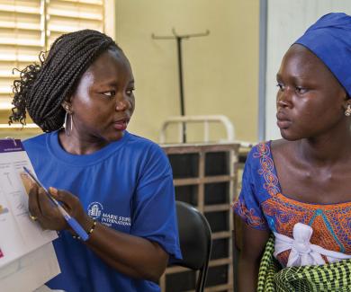 In a Laniar, Senegal, health center, a health worker from Marie Stopes offers reproductive health counseling and family planning in 2014.