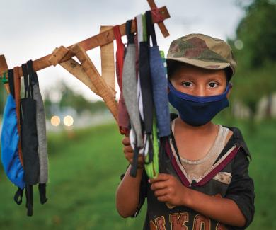 Ramazan, 9, selling masks in Islamabad, Pakistan